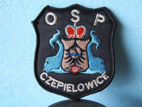 Emblemat OSP Czepielowice. Na emblemacie herb gminy Lubsza , na terenie której to leży nasza miejscowość.